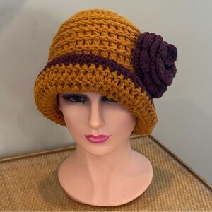 Handmade crocheted wool hat with flower size small to medium.